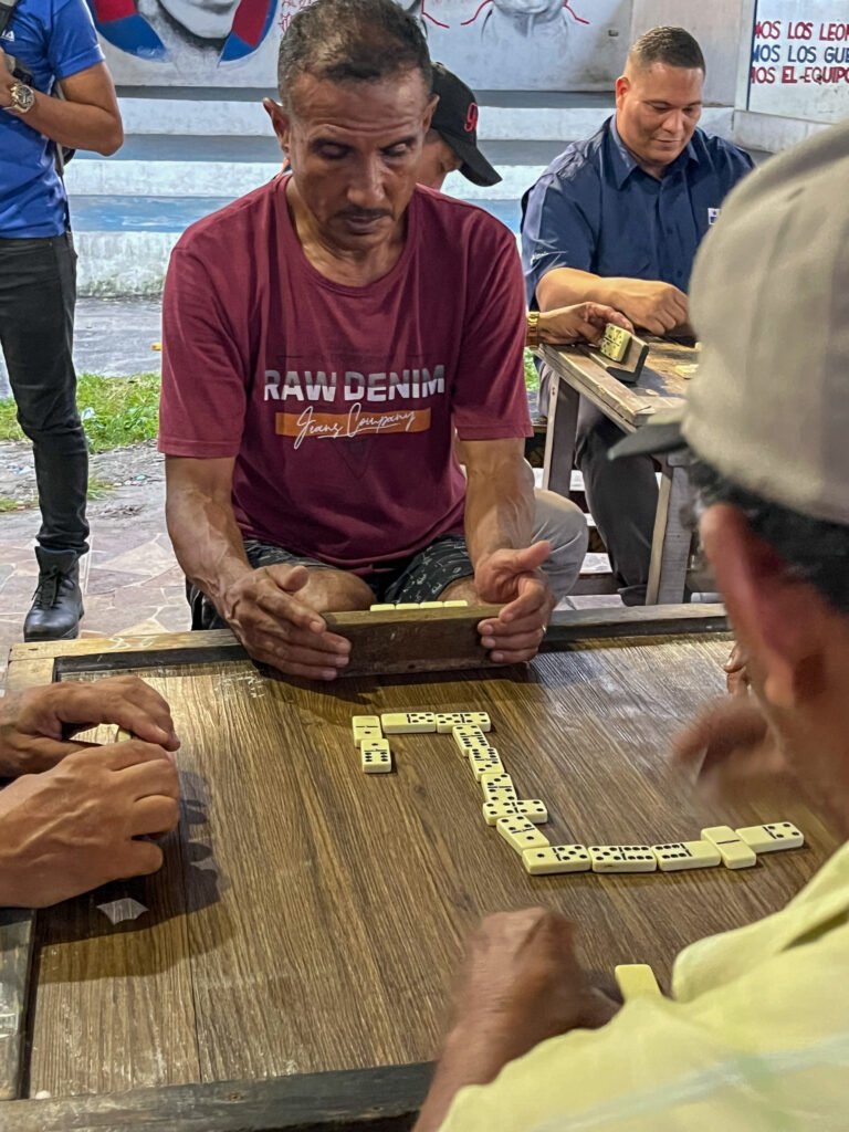 Men playing dominoes in El Chorillo