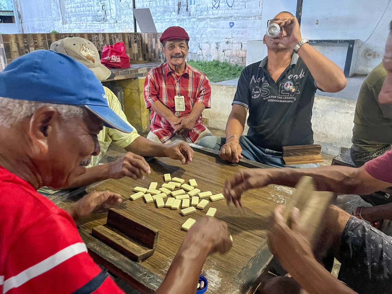 Men playing dominoes in El Chorillo